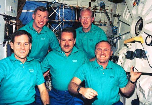 STS-48 crew poses for onboard (inflight) portrait on OV-103's middeck