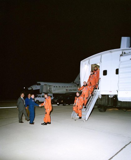 STS-48 crew, exiting CTV, is greeted by astronaut Richards at EAFB, Calif