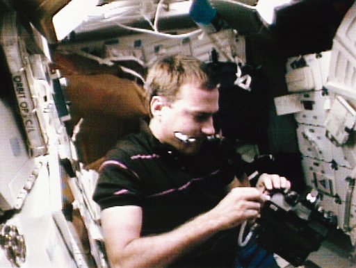 STS-49 MS Hieb changes ESC batteries on the middeck of OV-105
