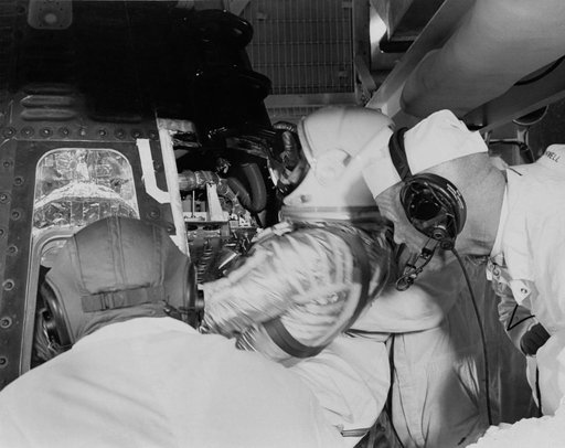 Astronaut Grissom climbs into Liberty Bell 7 capsule to begin MR-4 mission