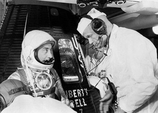 Astronaut Grissom talks to backup John Glenn prior to insertion