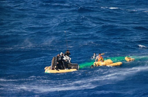 GEMINI-TITAN (GT)-3 - RECOVERY OPERATIONS - ASTRONAUT JOHN W. YOUNG (SPACECRAFT IN WATER) - ATLANTIC