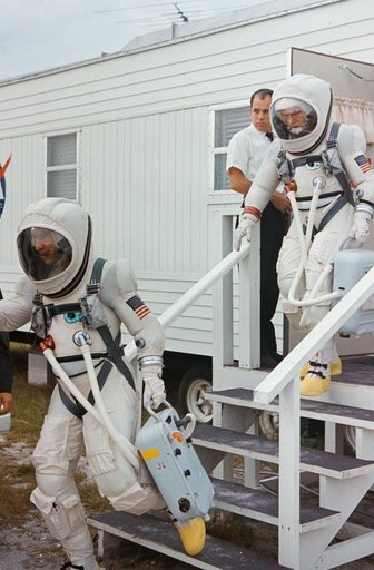 GEMINI-TITAN (GT)-7 - PRELAUNCH ACTIVITY - COMMAND PILOT (LEAVES SUITING TRAILER)  - CAPE