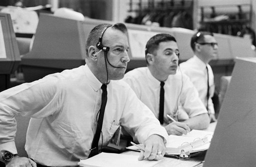 Gemini 8 spacecraft communicators James A. Lovell Jr and William A. Anders in the MCC