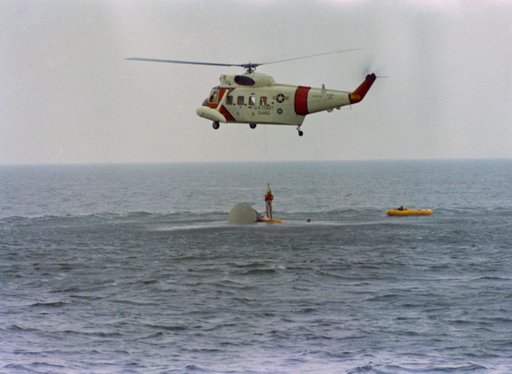 Astronaut John Young hoisted aboard helicopter during water egress training