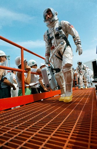 Astronauts Young and Collins walk up ramp at Pad 19 during countdown