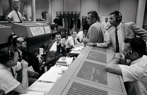 Personnel discussing Gemini 11 space flight in Mission Control