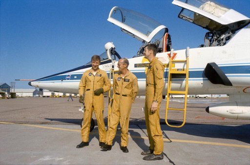 Prime crew of the Skylab 2 mission stand beside T-38 prior to take off