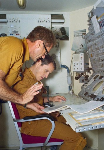 Astronauts Gibson and Pogue at Apollo Telescope Mount display/control panel
