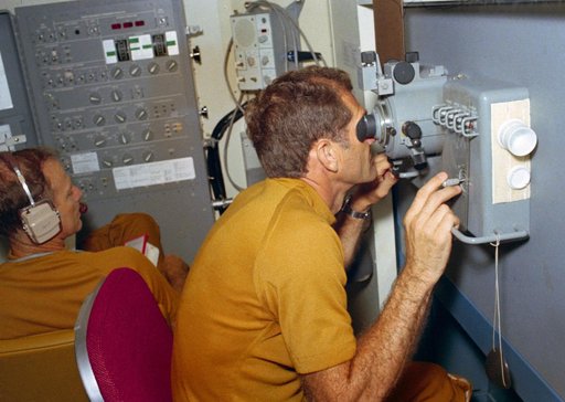 Astronaut William Pogue using Skylab Viewfinder Tracking System experiment