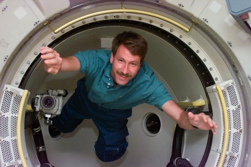 Pilot Kent Rominger floats in tunnel