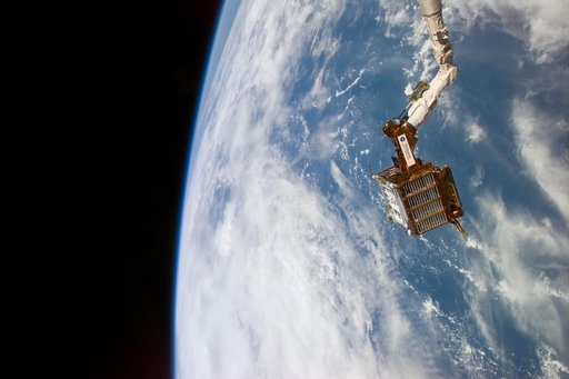 SPARTAN satellite on RMS arm