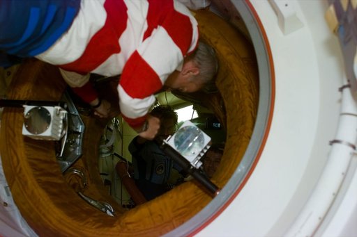 STS-79 commander at entrance to docking module