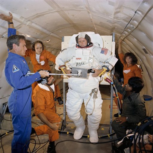 Astronaut C. Gordon Fullerton in suit donning/doffing exercise