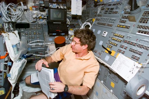 STS-81 crewmembers on the orbiter's flight deck