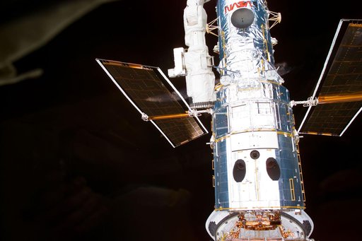 HST, survey views of telescope after berthing