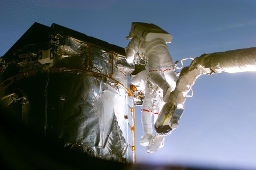 EVA 4 activity on Flight Day 7 to service the Hubble Space Telescope