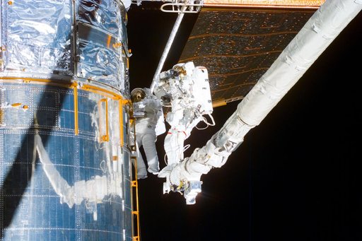 EVA 5 activity on Flight Day 8 to service the Hubble Space Telescope