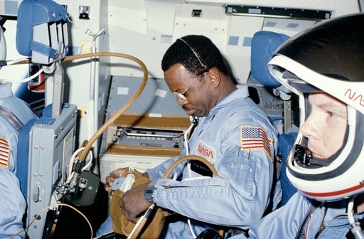 Astronauts McNair and Stewart prepare for on-orbit operations