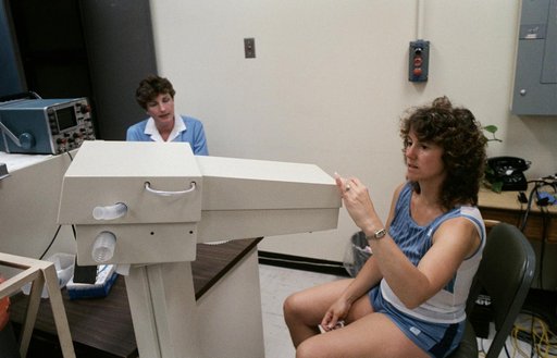 Teacher Christa McAuliffe prepare to test her lung capacity