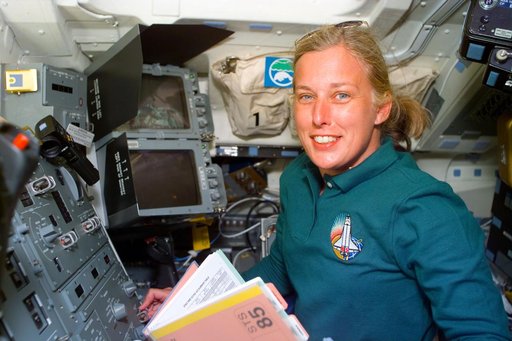 MS Davis   at work in Discovery's flight deck