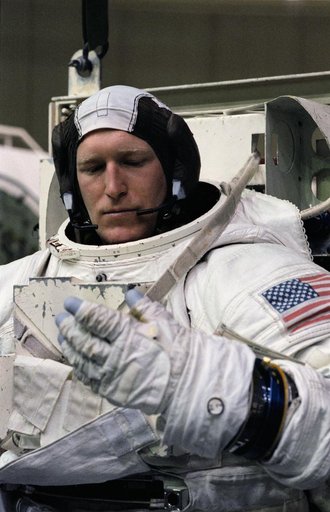 Astronaut Sam Gemar, wearing EMU, prepares for training in WETF