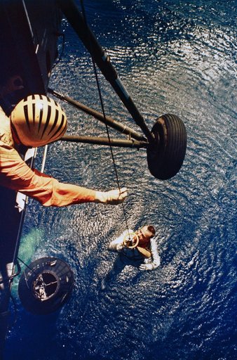 Astronaut Alan Shepard is rescued by helicopter at end of MR-3 flight