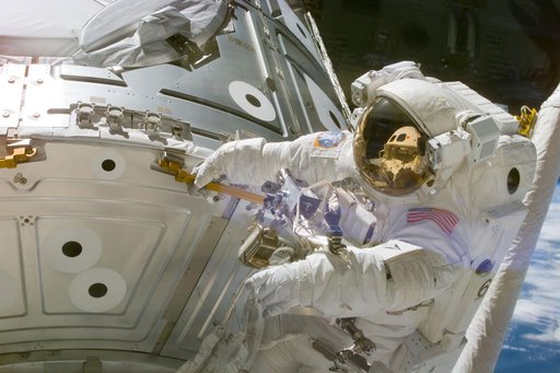 Astronaut Newman holds onto handrail 0133 on panel NOD1/C2-07
