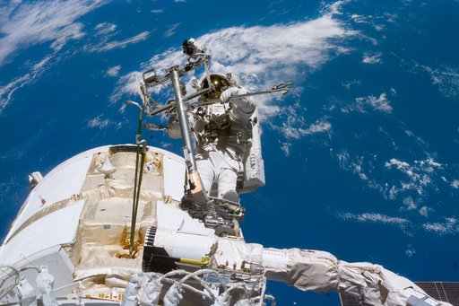 Newman on RMS arm after deploying TORU antenna on FGB/Zarya module