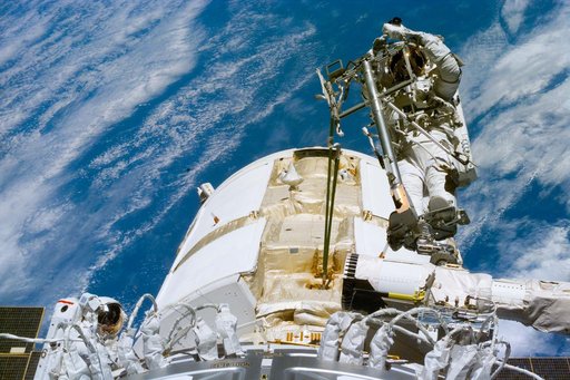 Newman on RMS arm after deploying TORU antenna on FGB/Zarya module