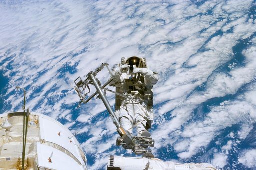 Newman on RMS arm after deploying TORU antenna on FGB/Zarya module