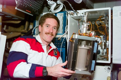 MGM - MS Reilly holds a container used in the MGM experiment