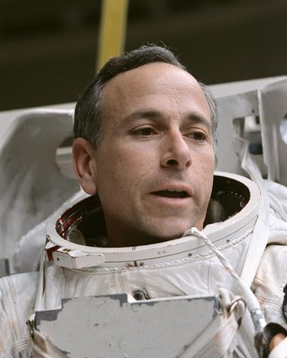 STS-38 Mission Specialist (MS) Carl J. Meade during EMU donning in JSC's WETF