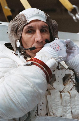 STS-38 Mission Specialist (MS) Robert C. Springer dons EMU in JSC's WETF