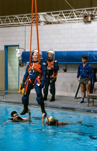 STS-35 Commander Brand is suspended over JSC WETF pool during egress exercise