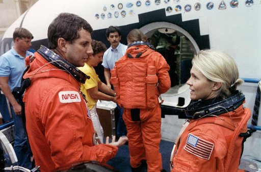 STS-40 crewmembers prepare for emergency egress training in JSC's MAIL