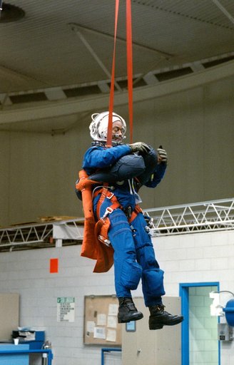 STS-39 MS Bluford is suspended over JSC's WETF Bldg 29 pool via harness