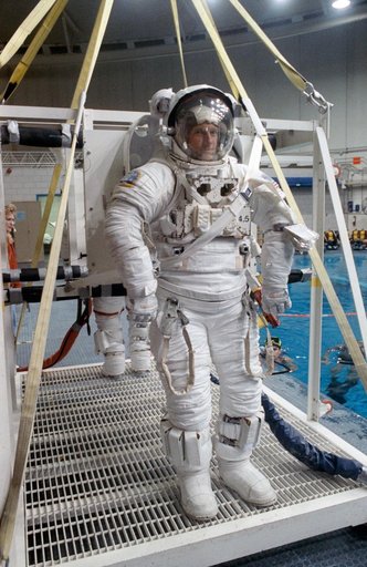 STS-45 MS Foale in EMU prepares for underwater exercises in JSC's WETF pool