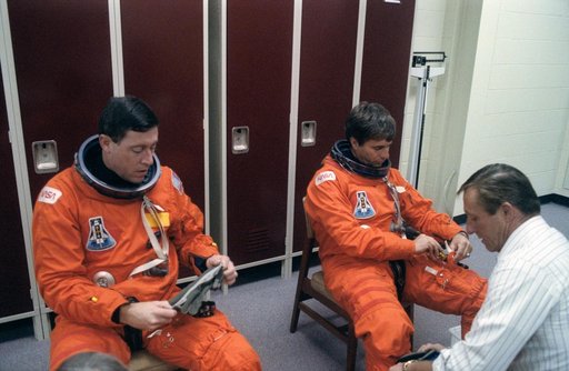 STS-43 Atlantis, OV-104, crew prepares for egress training in JSC's MAIL