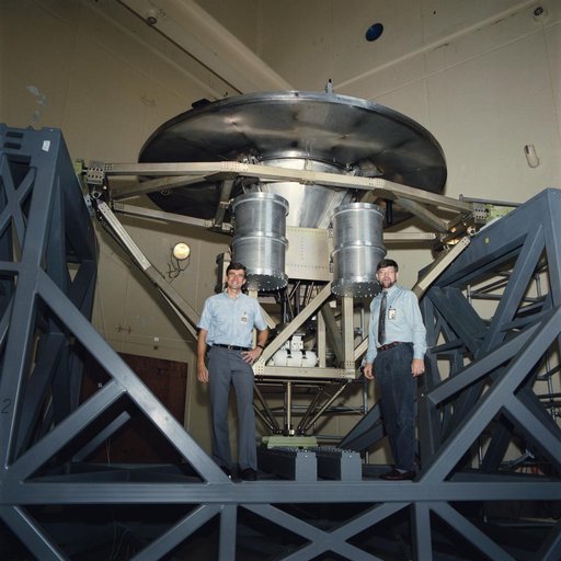 Astronaut Ronald Sega with Wake Shield Facility on test stand at JSC