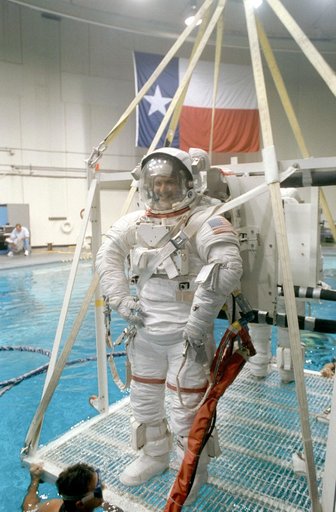 STS-57 MS3 Wisoff in EMU is lowered into JSC's WETF pool for EVA simulation