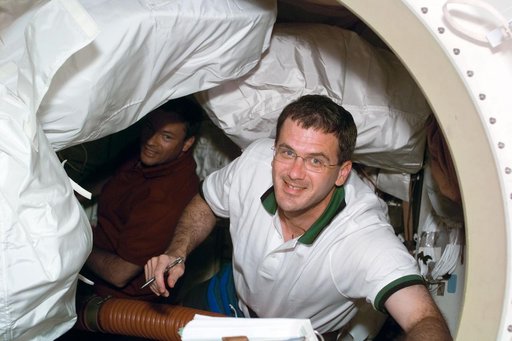 STS-92 crewmember Peter (Jeff) Wisoff with Michael Lopez-Alegria in the background