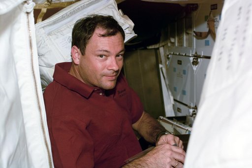 Various portrait views of STS-92 crewmember Michael Lopez-Alegria smiling for the camera.