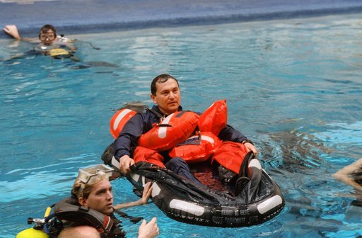 STS-60 Cosmonauts in Weightless Environment Training Facility (WETF) training