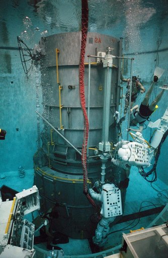 STS-61 crewmembers in the WETF rehearsing for HST repair mission