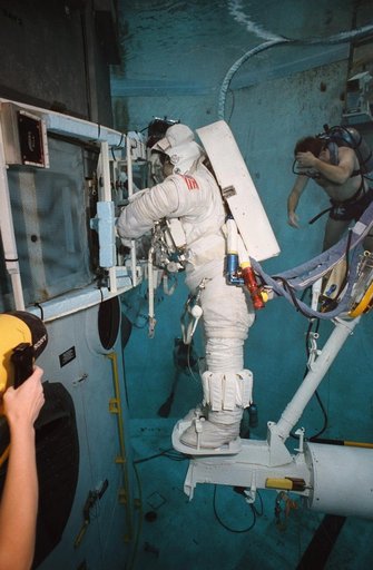 STS-61 crewmembers in the WETF rehearsing for HST repair mission