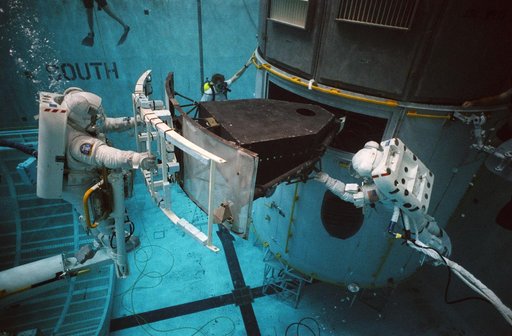 STS-61 crewmembers in the WETF rehearsing for HST repair mission