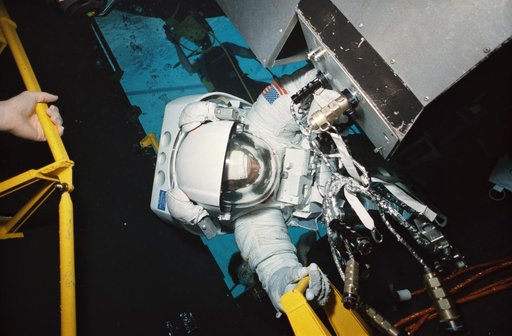 STS-61 crewmembers in the WETF rehearsing for HST repair mission