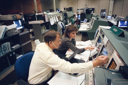 Astronauts Ross and Helms at CAPCOM station during STS-61 simulations