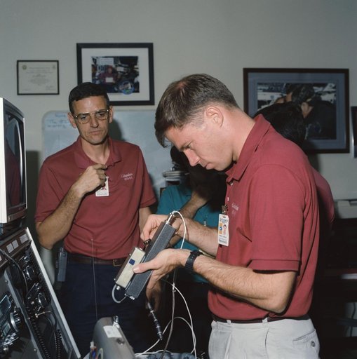 Members of STS-58 crew training with amateur radio equipment at JSC
